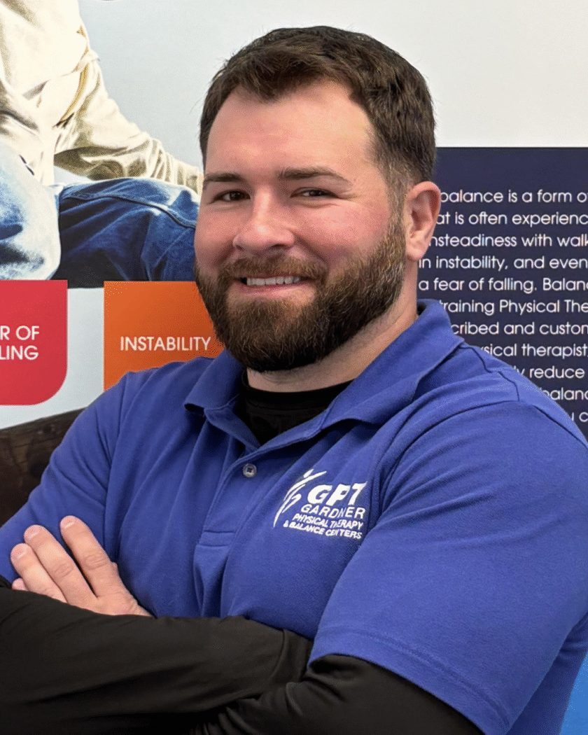 William Diodato, Physical Therapist Assistant at Gardner Physical Therapy, standing in front of a Balance Health display.