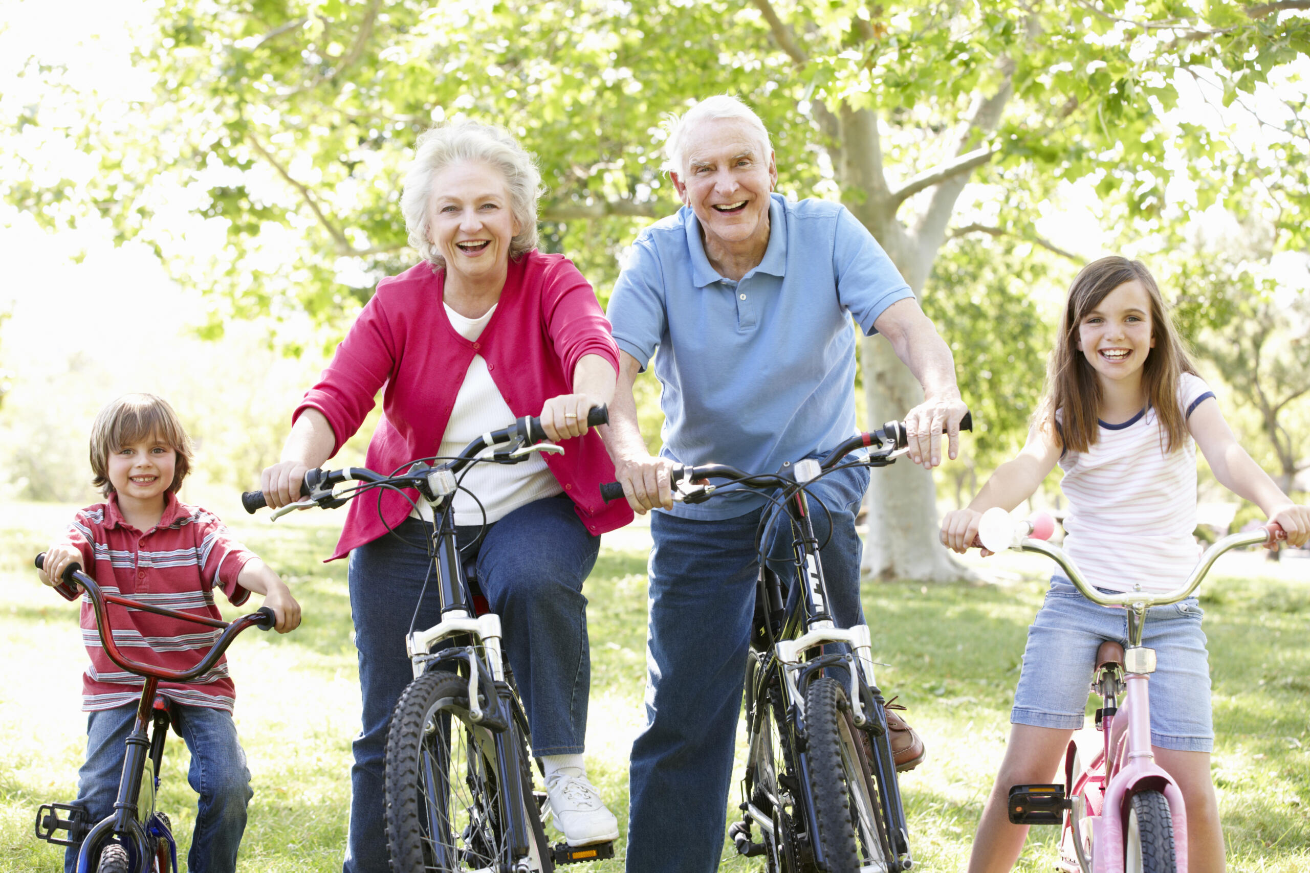 Senior,Couple,With,Grandchildren,On,Bikes - Gardner Physical Therapy Gardner Physical Therapy treatment center