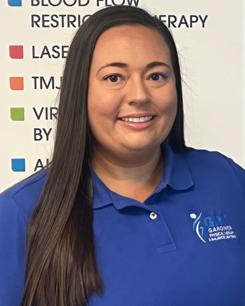 Sarah Grant, PTA at Gardner Physical Therapy, smiling in a clinic setting, passionate about balance and mobility rehab.
